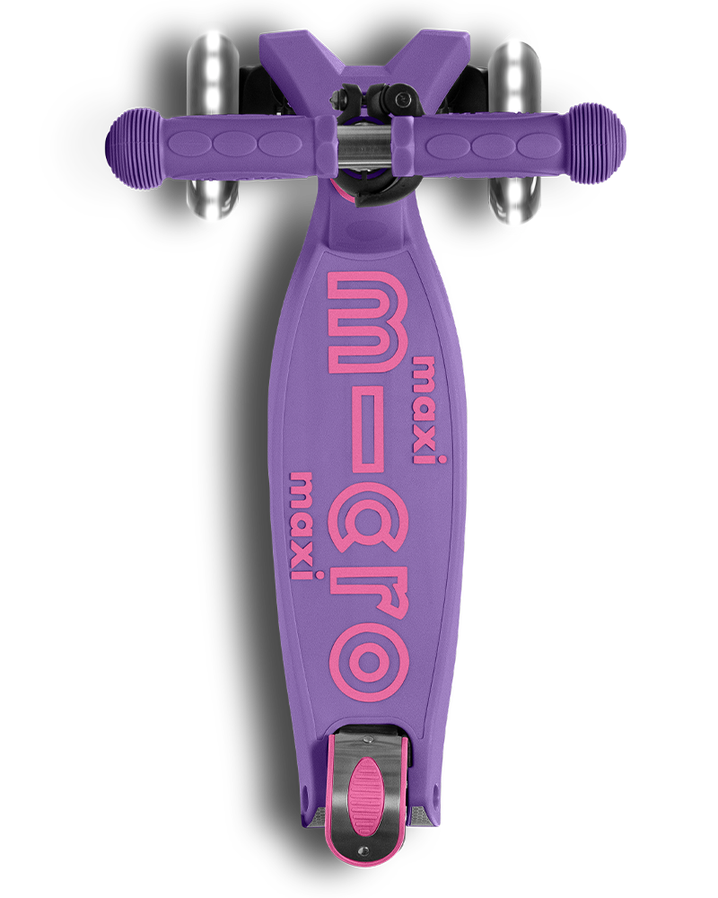 Purple scooter with pink 'Maxi Micro' branding on a white background