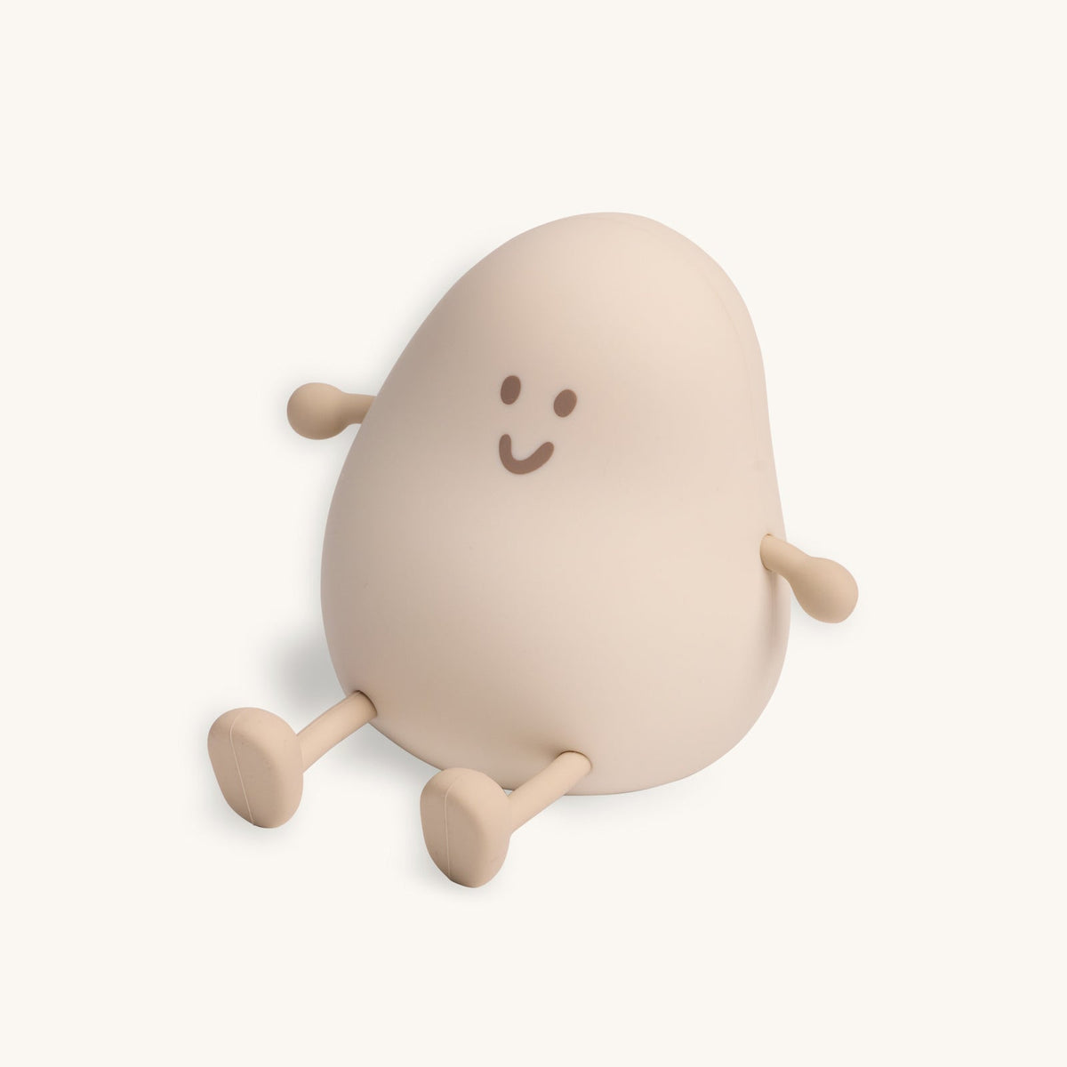 Beige plush toy with a happy face on a white background