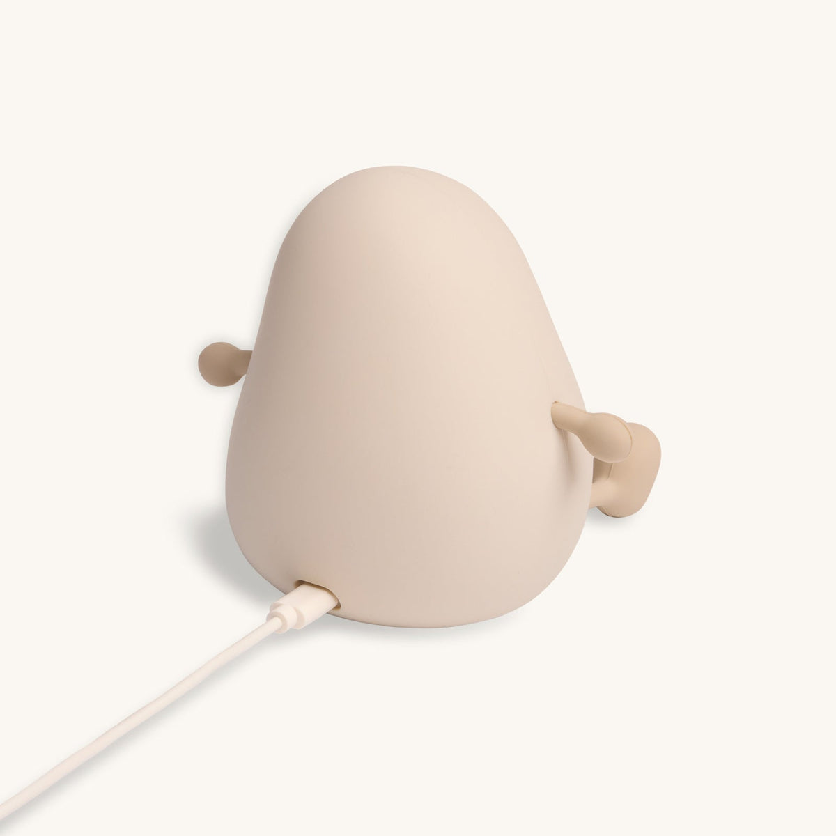 Beige lamp with a cable on a white background