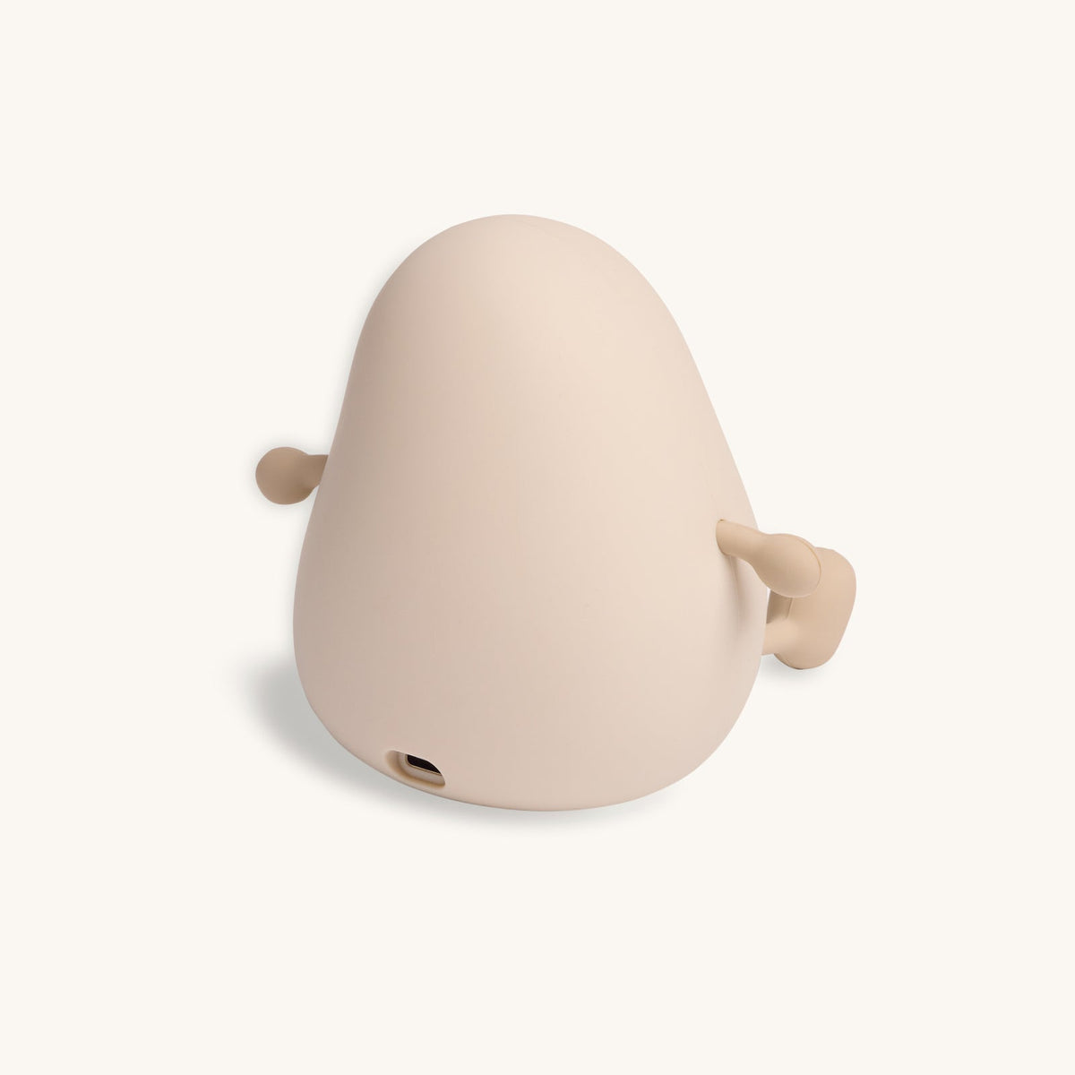 Beige whale-shaped object on a white background