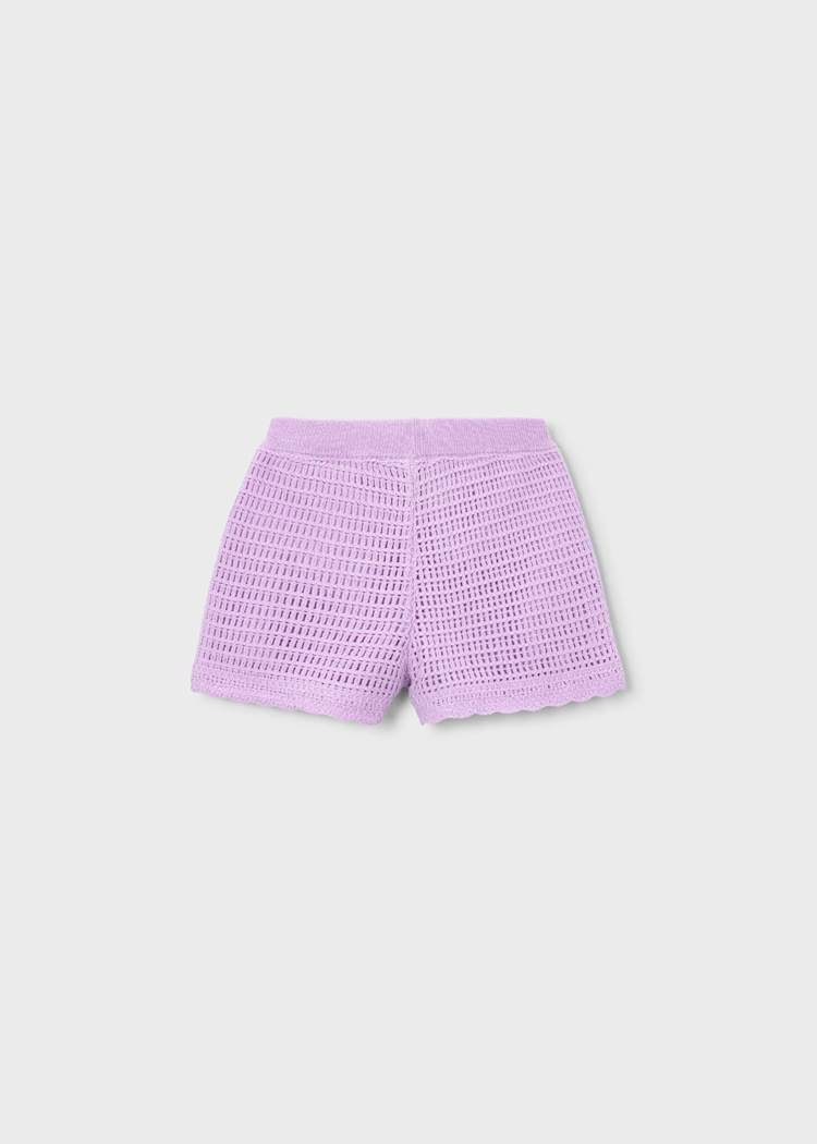 Purple checkered shorts on a light gray background