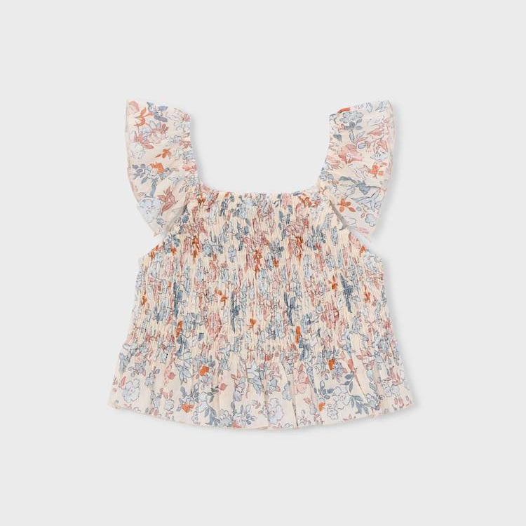 Floral baby top on a light gray background