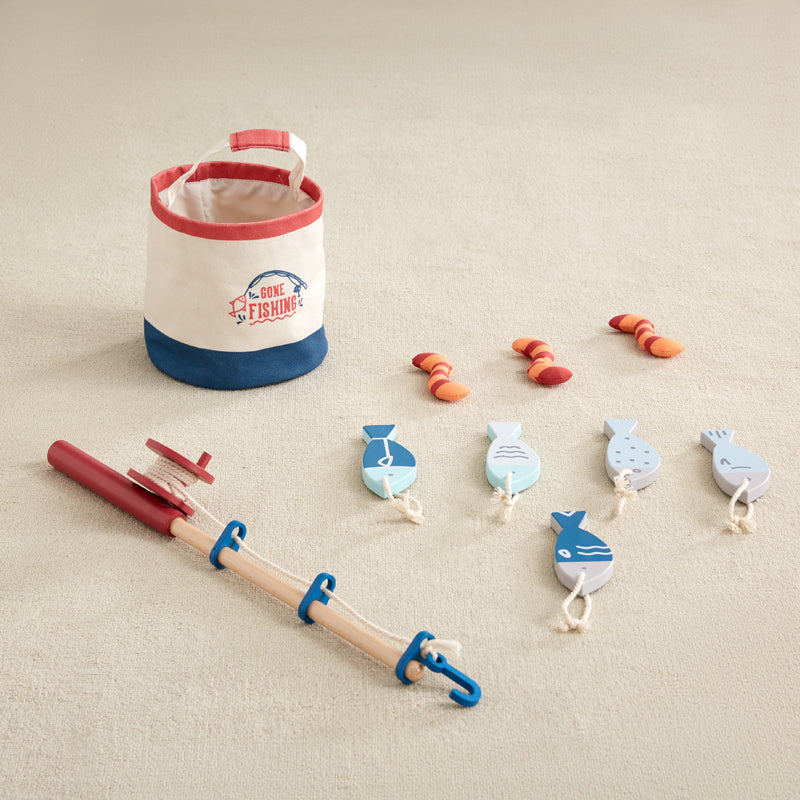 Fishing toy set with a bucket, rod, and accessories on a white background