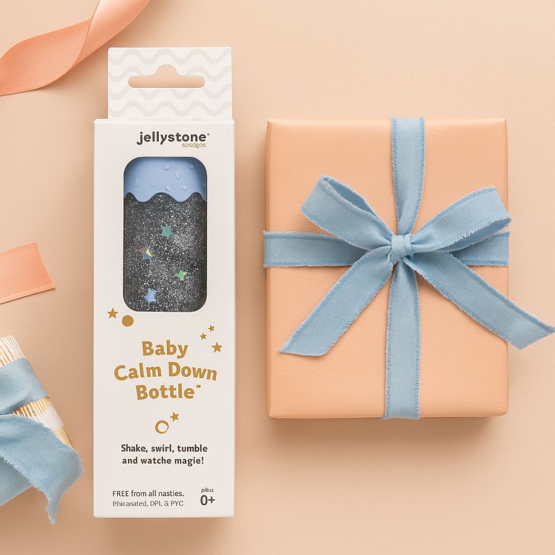 Jellystone baby calm down bottle packaging with a gift box on a beige background