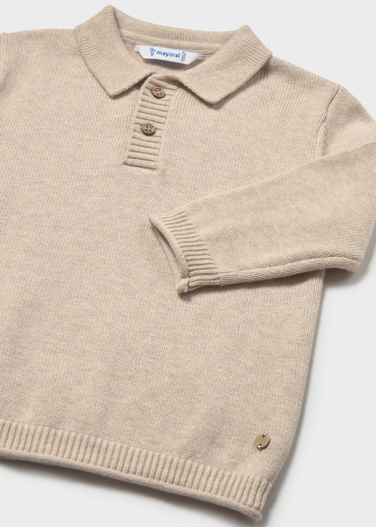Beige sweater with a collar on a white background