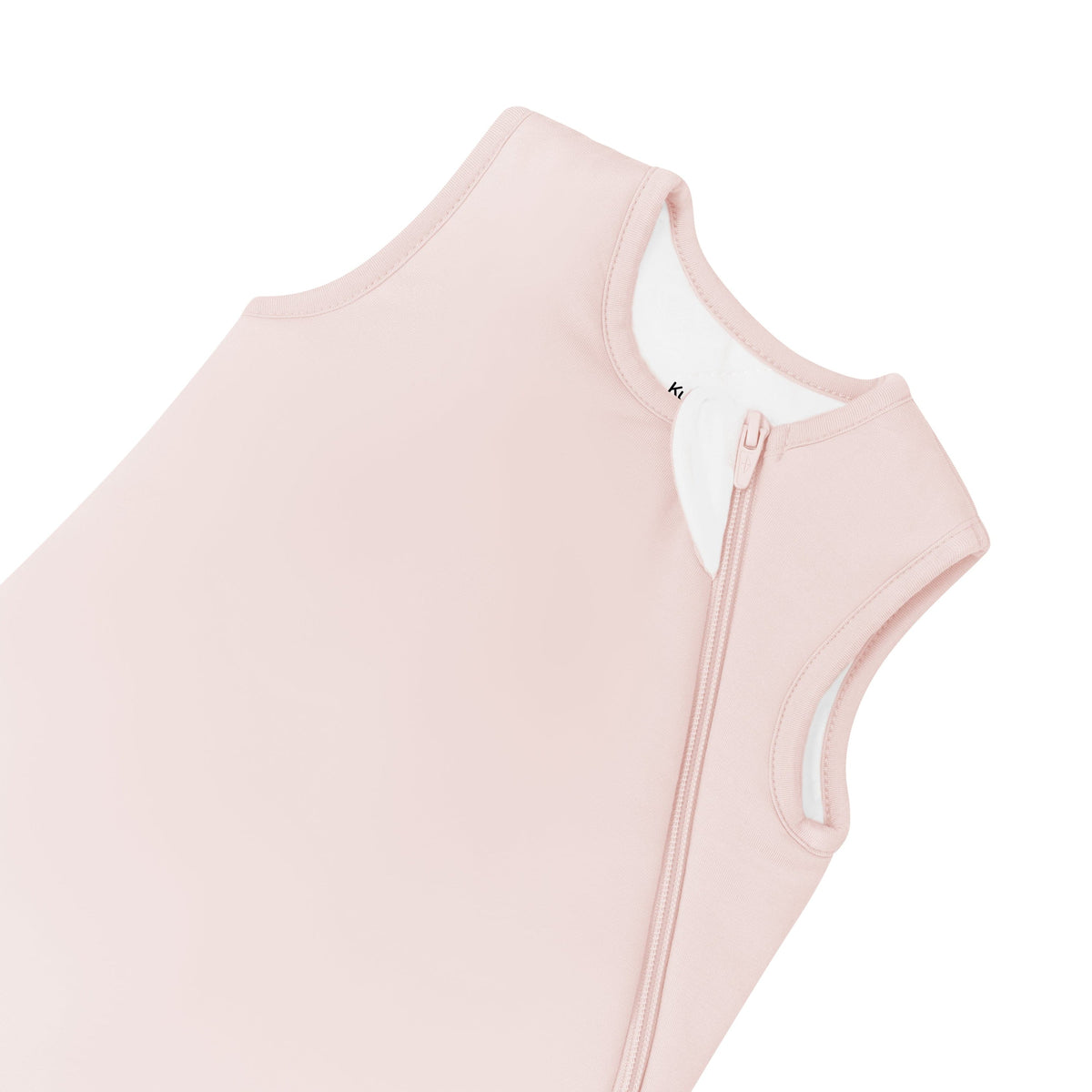 Pink baby romper with zipper on a white background