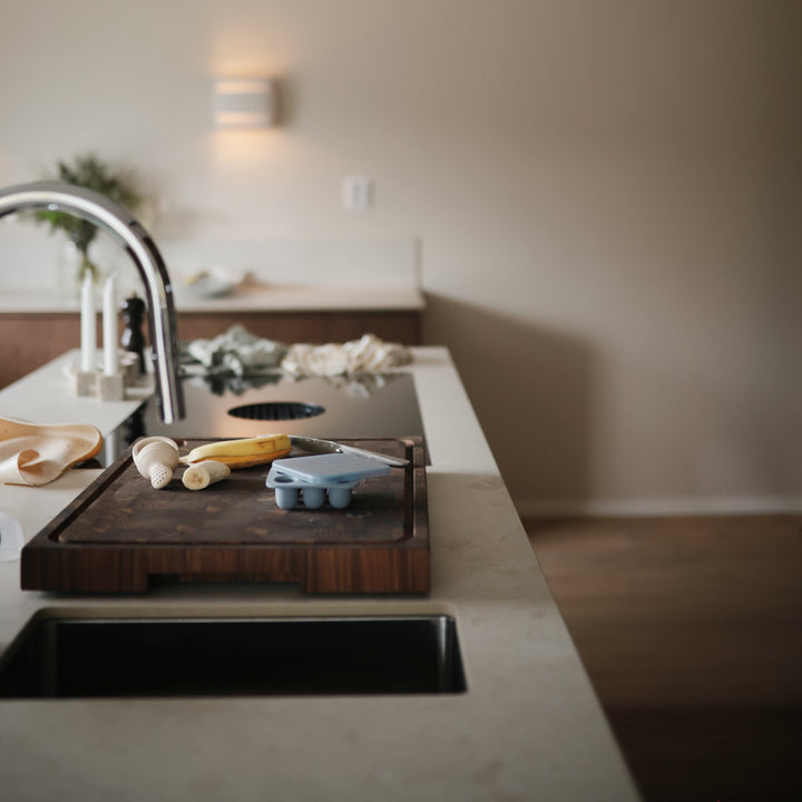 Modern kitchen with a cutting board on a countertop