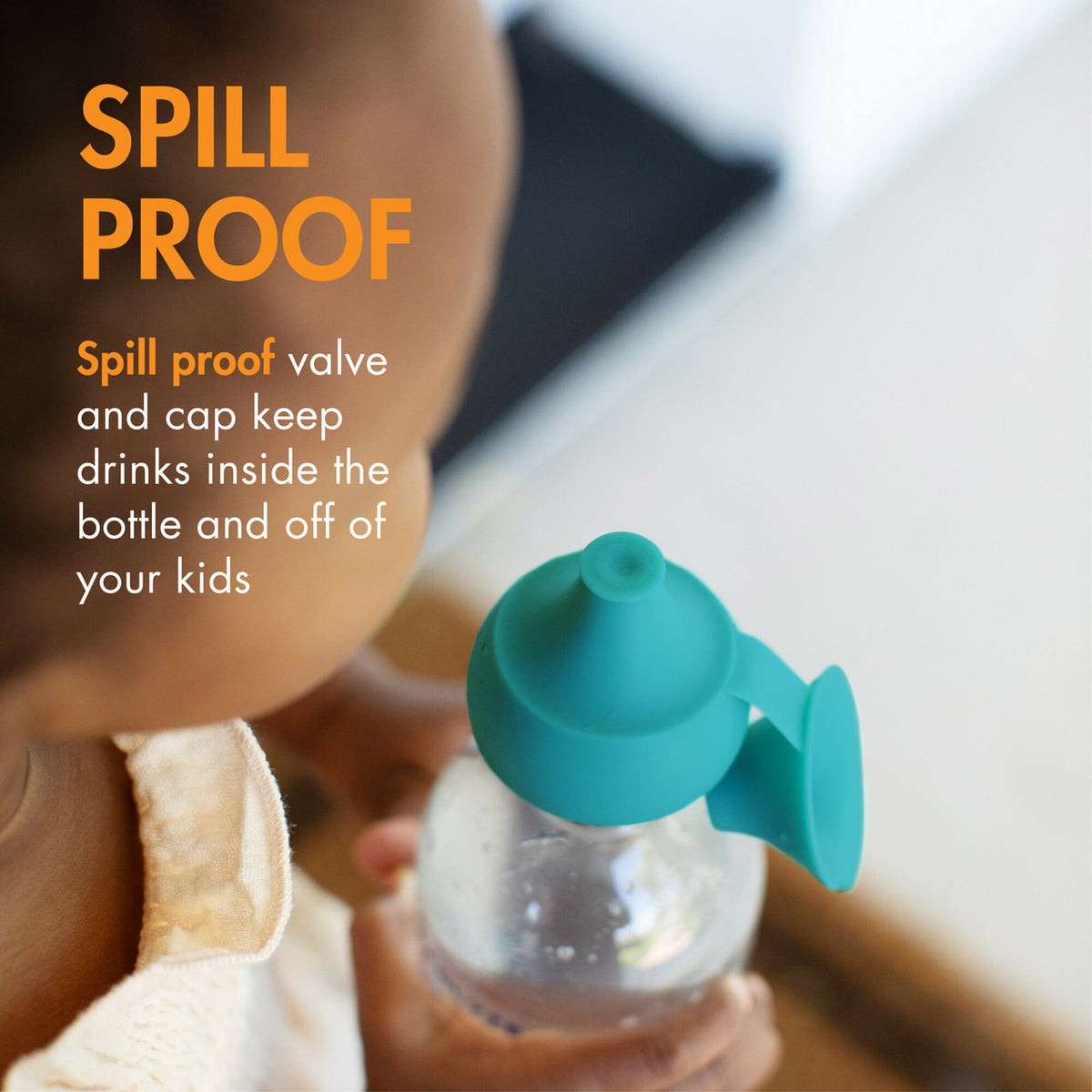 Teal bottle with spill proof feature held by a child, with text highlighting its spill-proof design.