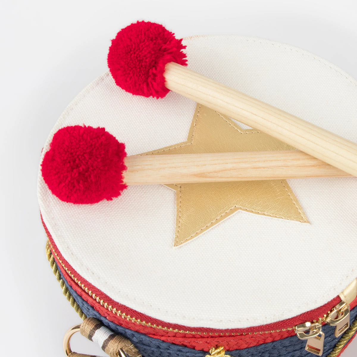 Meri Meri Drum Bag, a drum-shaped children's handbag inspired by traditional Nutcracker costumes.