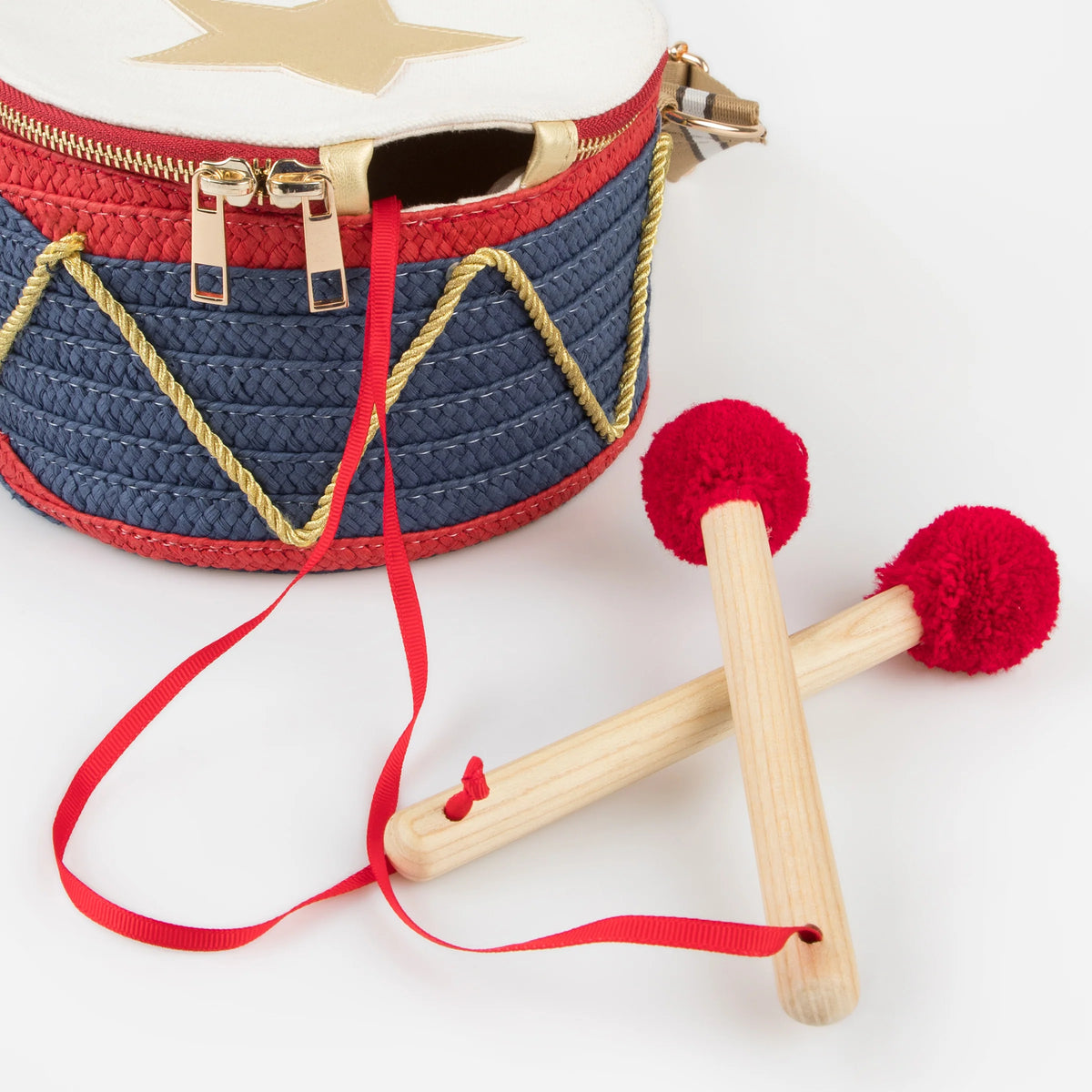 Meri Meri Drum Bag, a drum-shaped children's handbag inspired by traditional Nutcracker costumes.