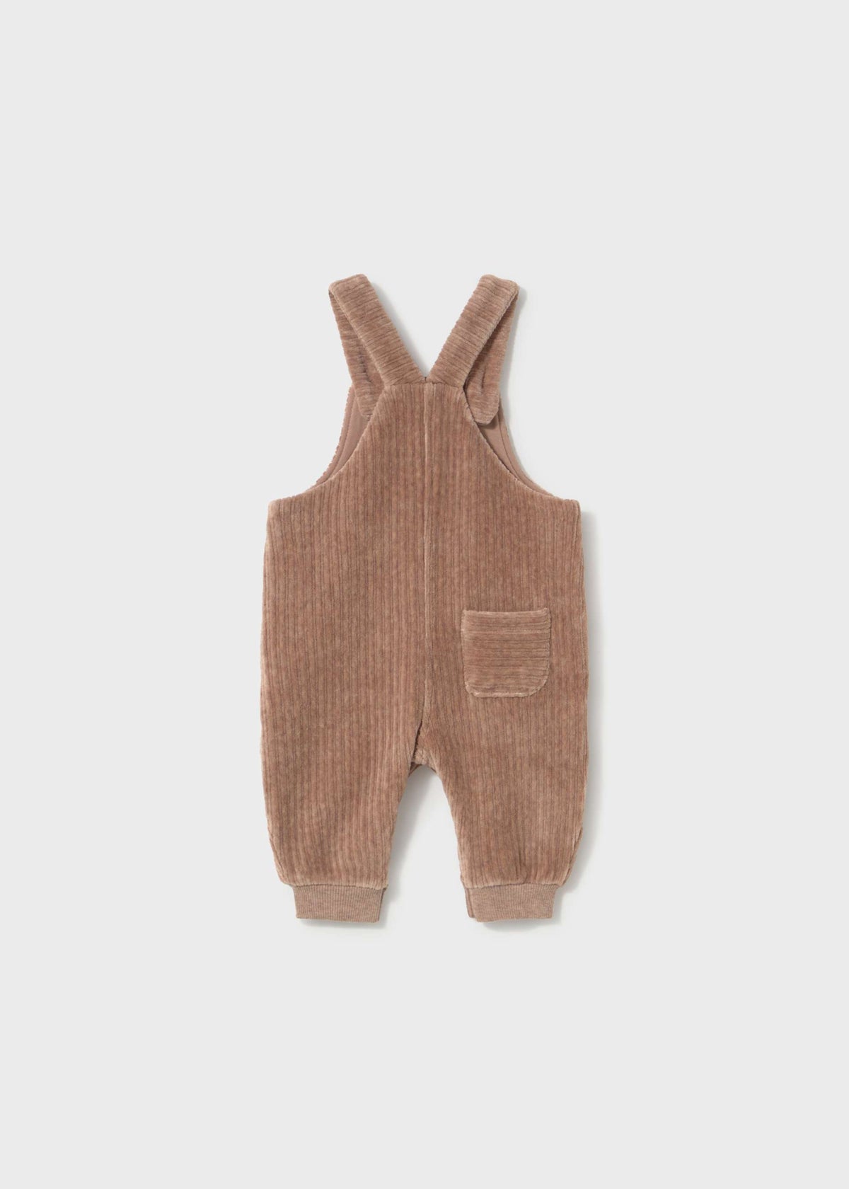 A baby's corduroy overall romper in a warm taupe-brown color, featuring adjustable shoulder straps, a front patch pocket, and ribbed cuffs, shown flat on a light gray background.