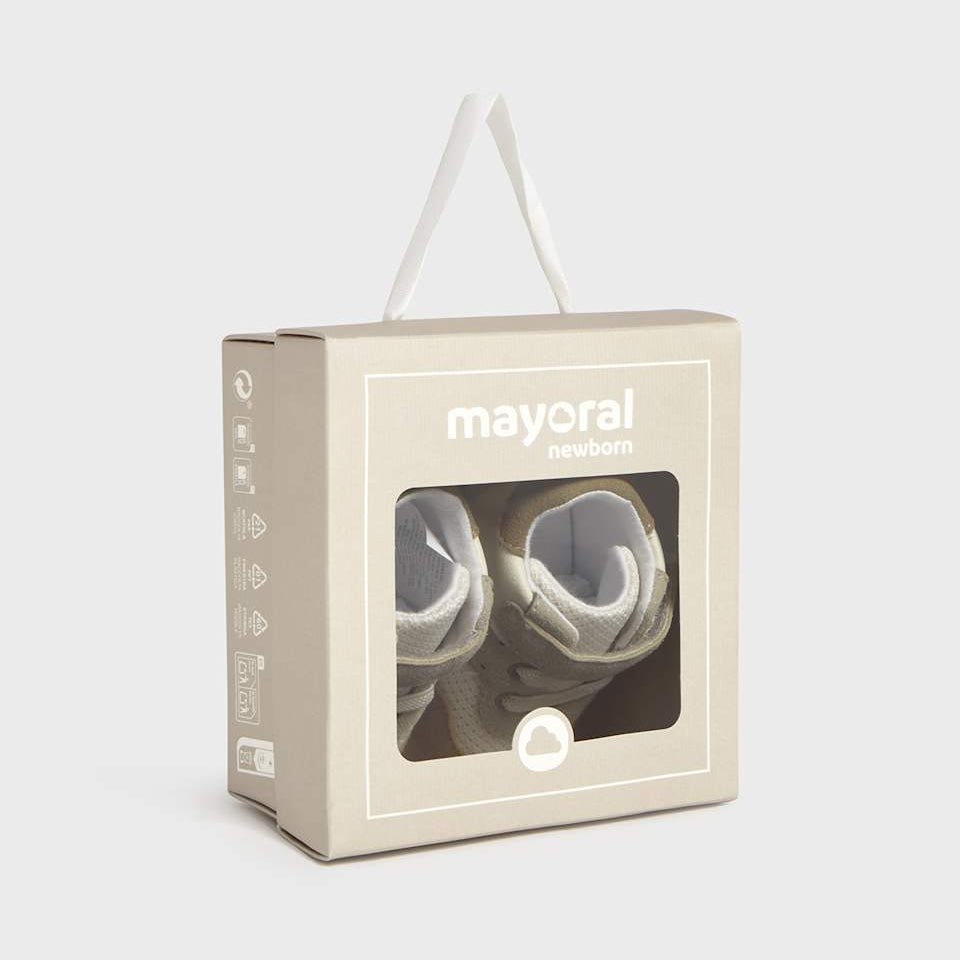 Mayoral baby booties in a beige box on a light gray background