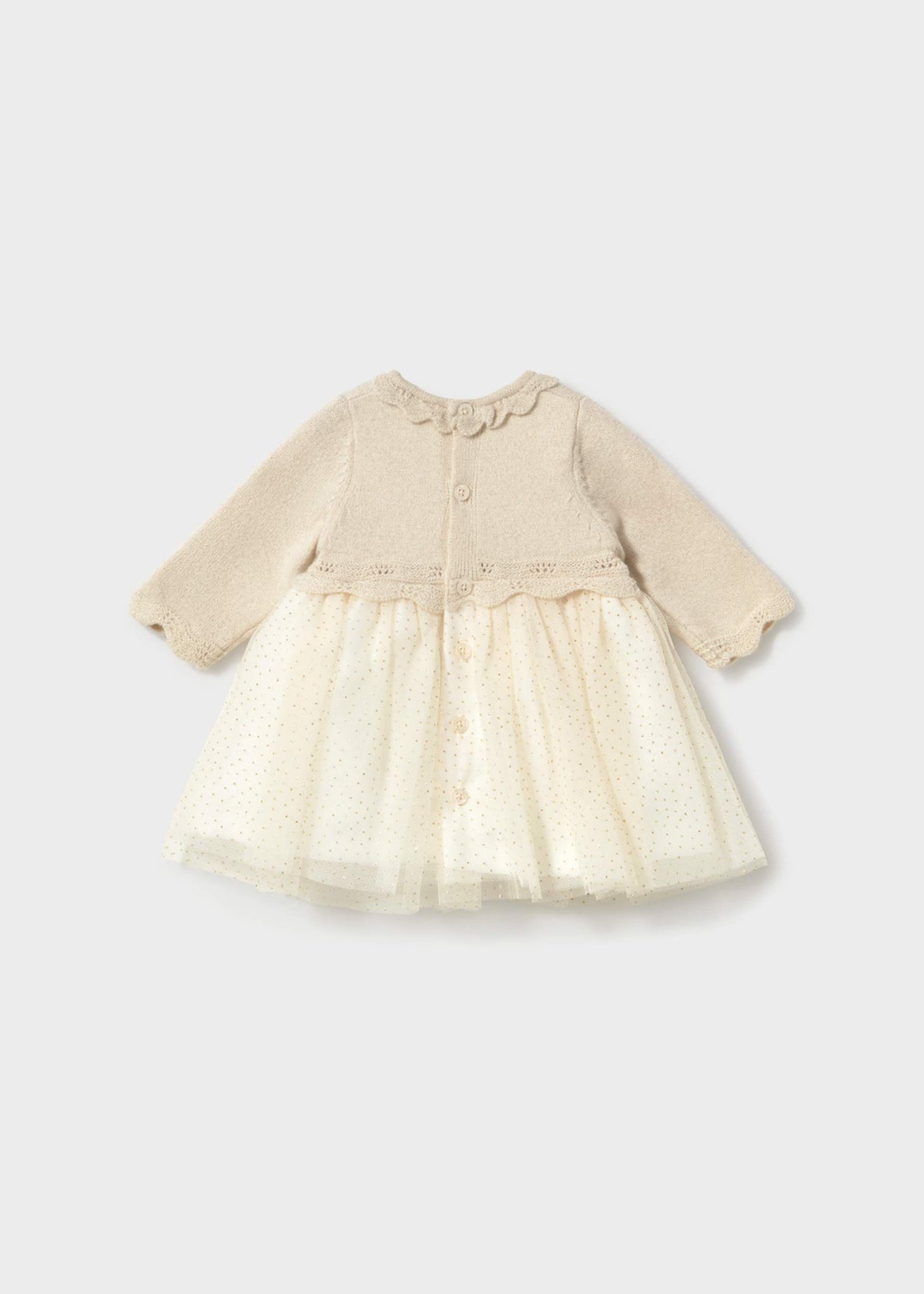 A baby girl's long-sleeve dress with a beige knit bodice and a cream tulle skirt, shown against a light gray background.