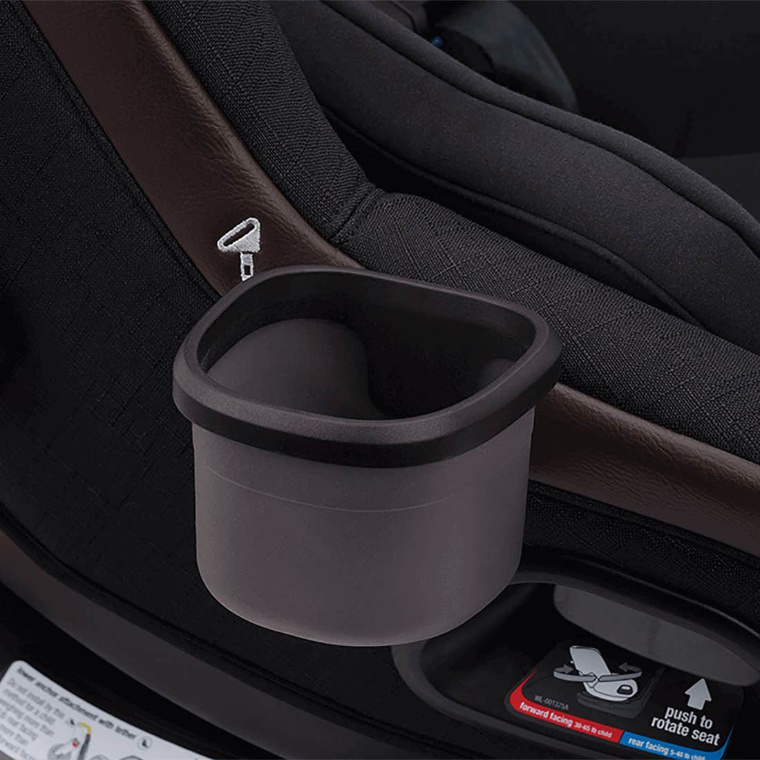 Black cup holder attached to a car seat