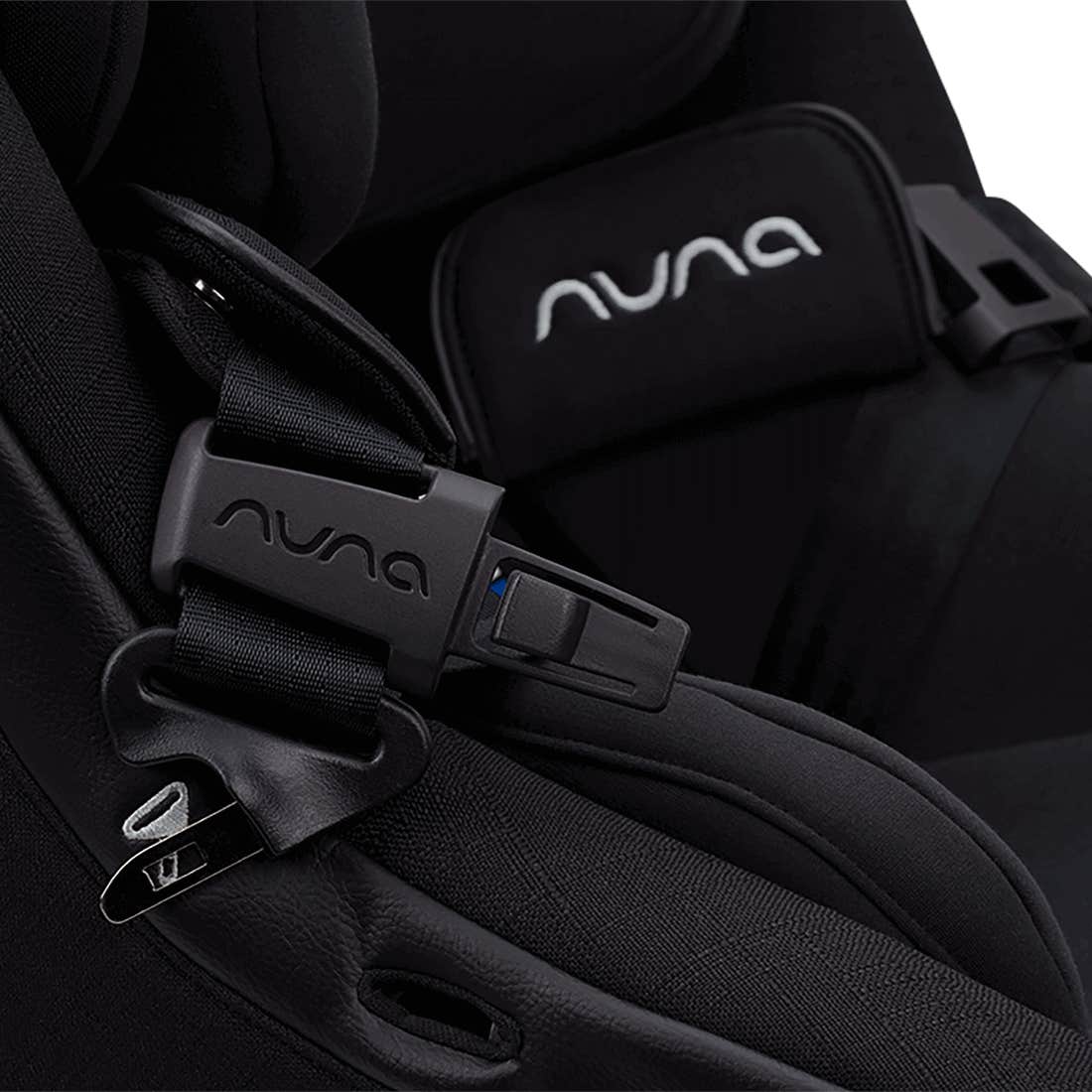 Close-up of a black Nuna car seat with visible branding.