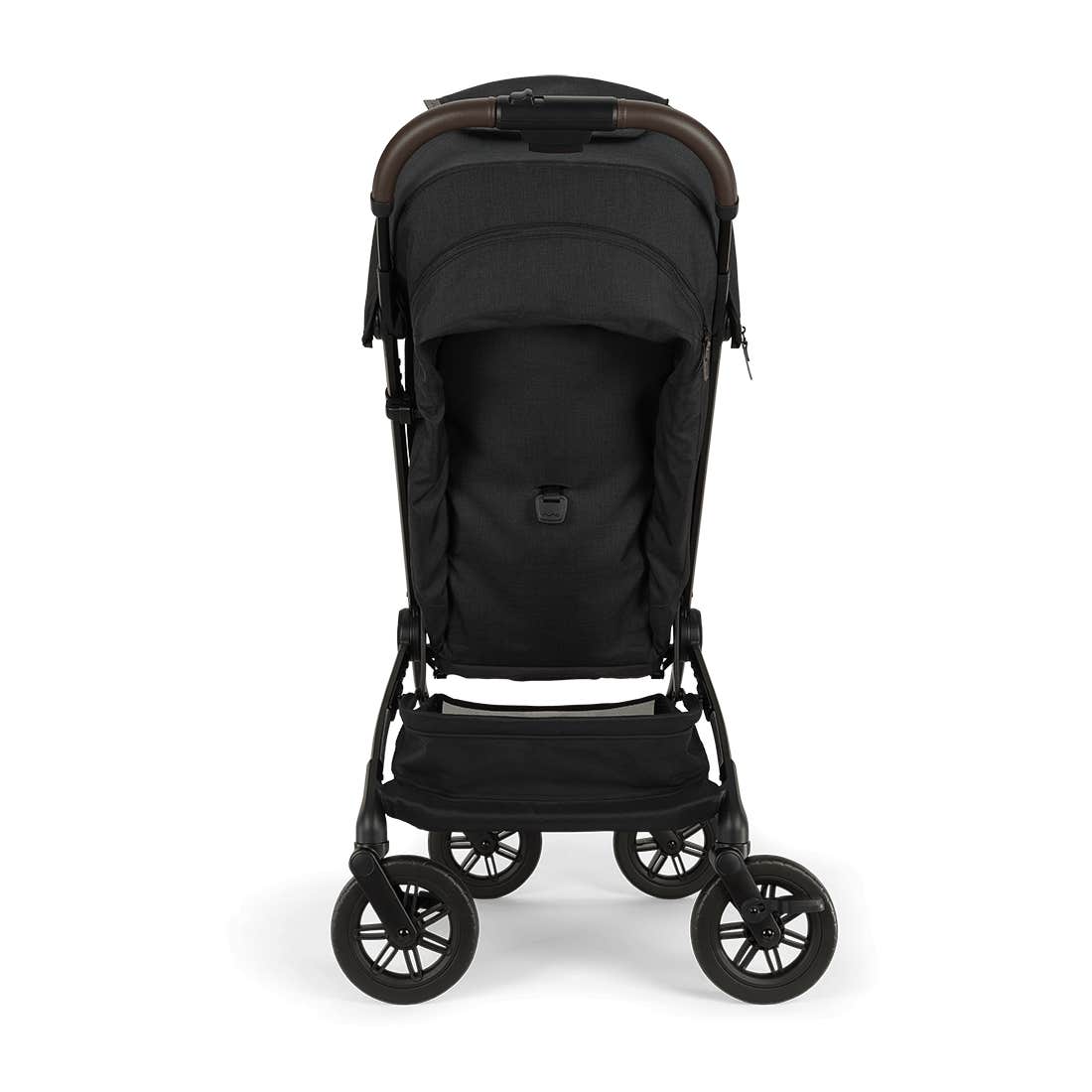 Nuna TRVL 360 lightweight travel stroller in Caviar black, shown in a three-quarters rear view against a clean white background. The stroller features a black sun canopy, a brown leatherette pushbar, an under-seat storage basket, and 360-degree swivel wheels.