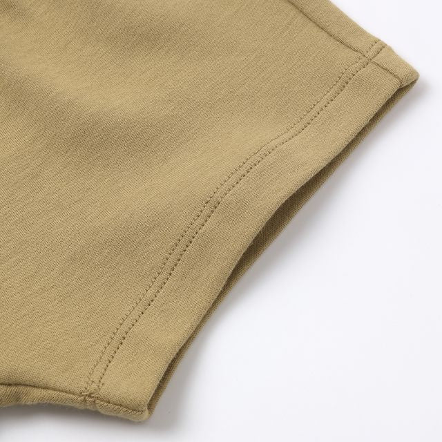Close-up of beige fabric on a white background