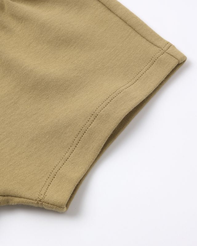 Close-up of beige fabric on a white background