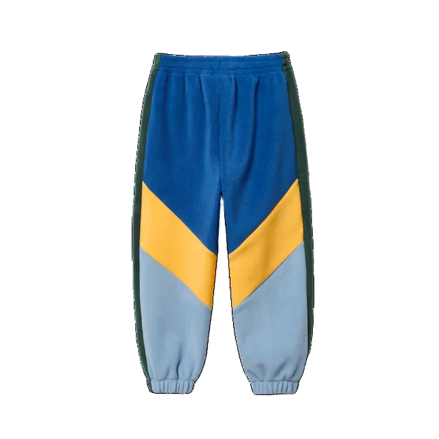 Colorblock fleece jogger pants in blue, yellow, and light blue with dark green side panels, shown on a plain white background.