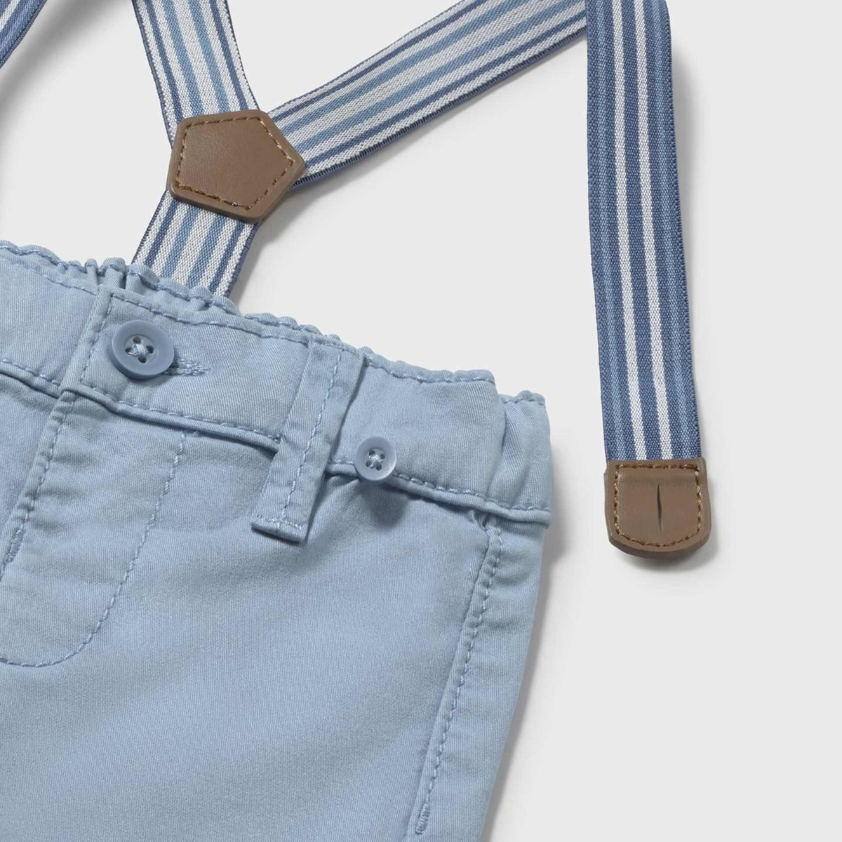 Light blue pants with striped suspenders on a white background