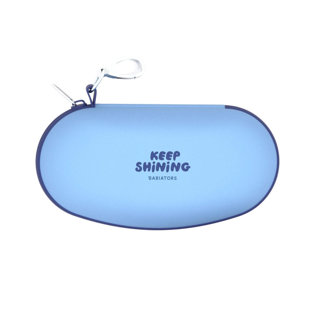 Blue sunglasses case with 'KEEP SHINING' text on a white background