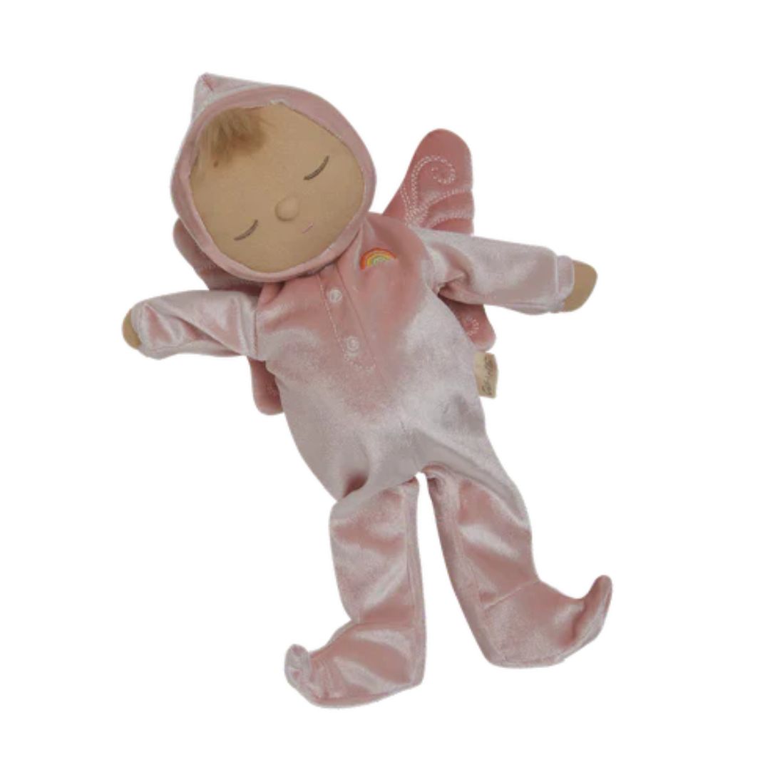 Stuffed baby doll in a pink outfit on a white background