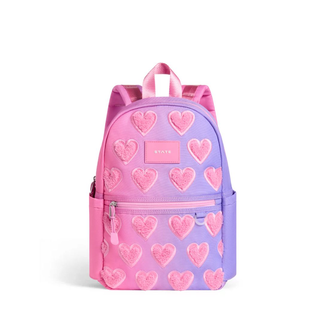 Backpack with pink heart pattern on a white background
