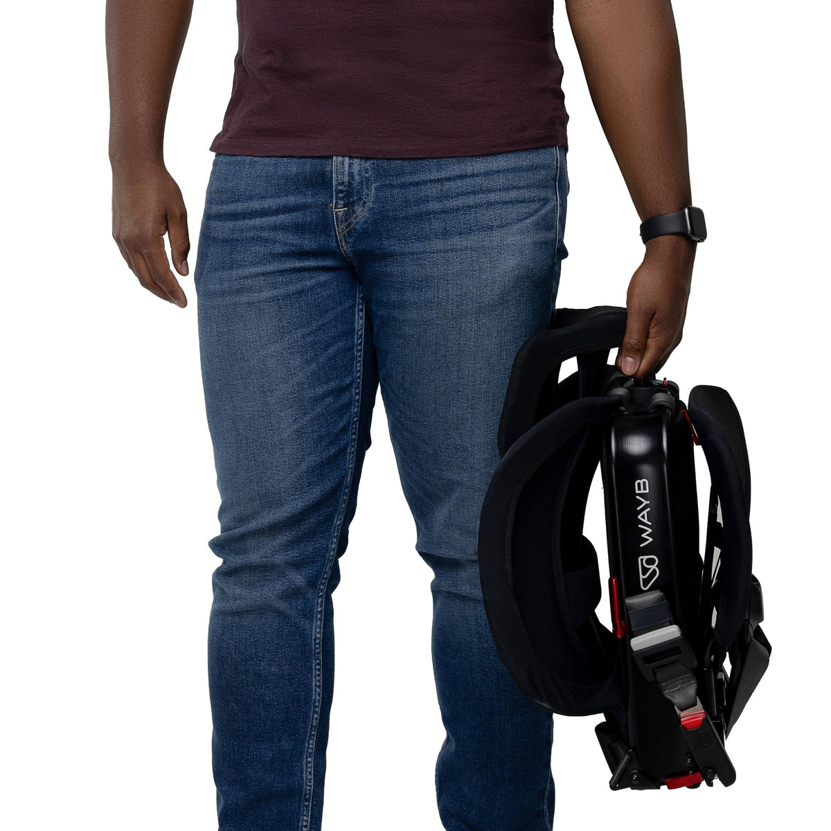 Person holding a black and red harness with 'WAYB' branding on a white background