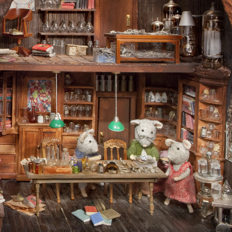 Diorama of animals in a vintage shop setting with shelves and products.
