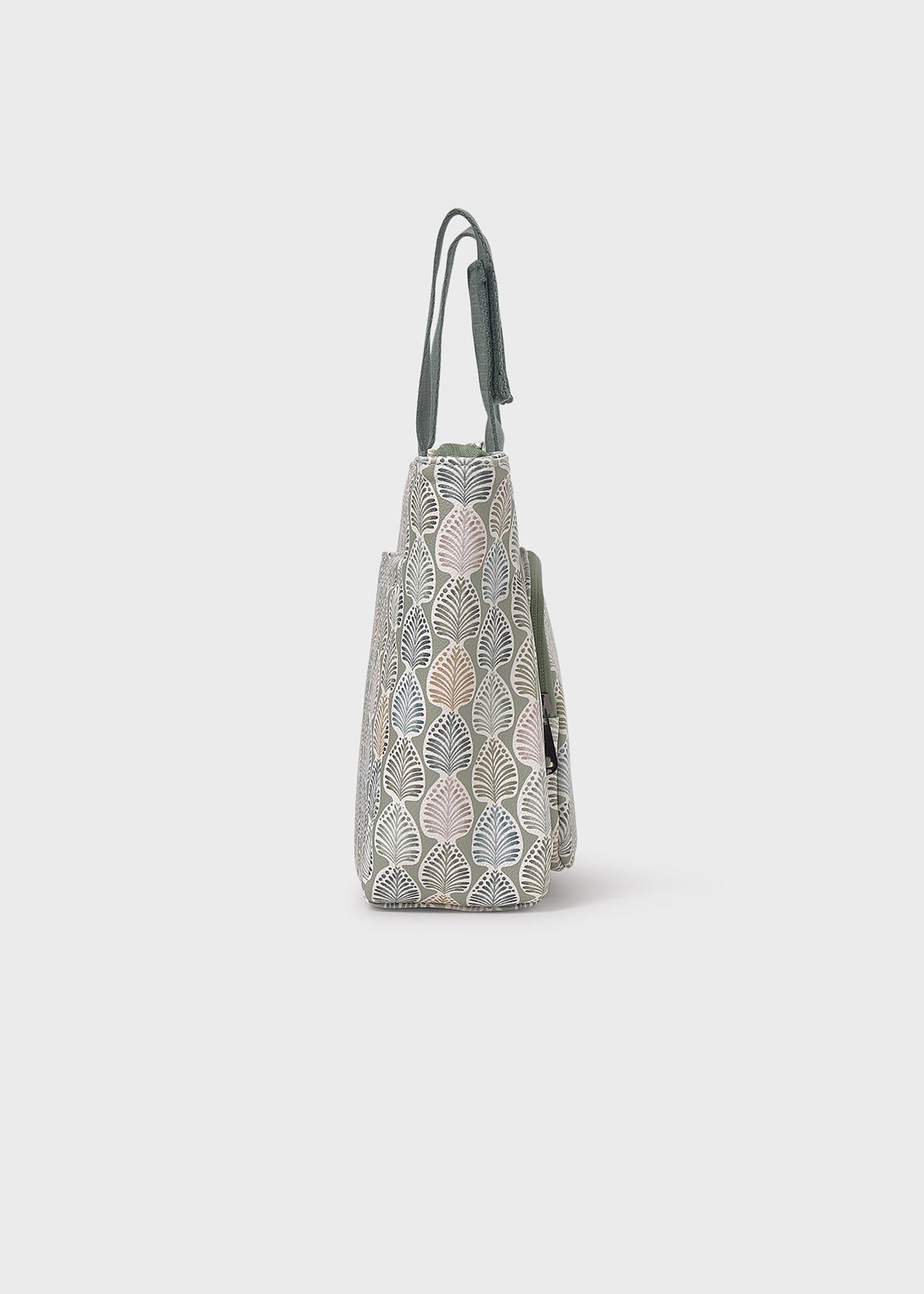 Handbag with leaf pattern on a light gray background