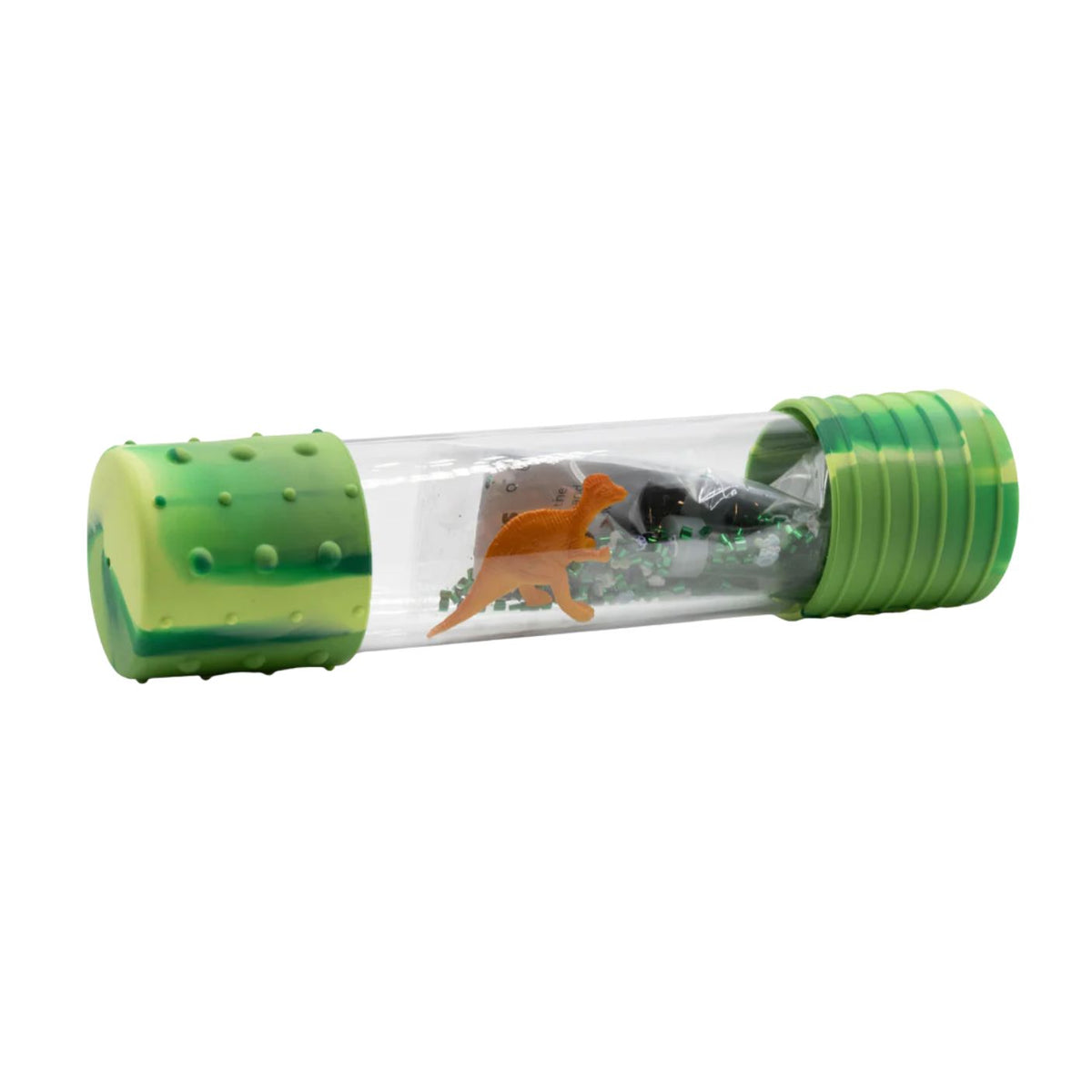 A clear cylindrical toy capsule with textured green ends, containing small dinosaur figurines and green leaf-like pieces inside, shown on a plain white background.