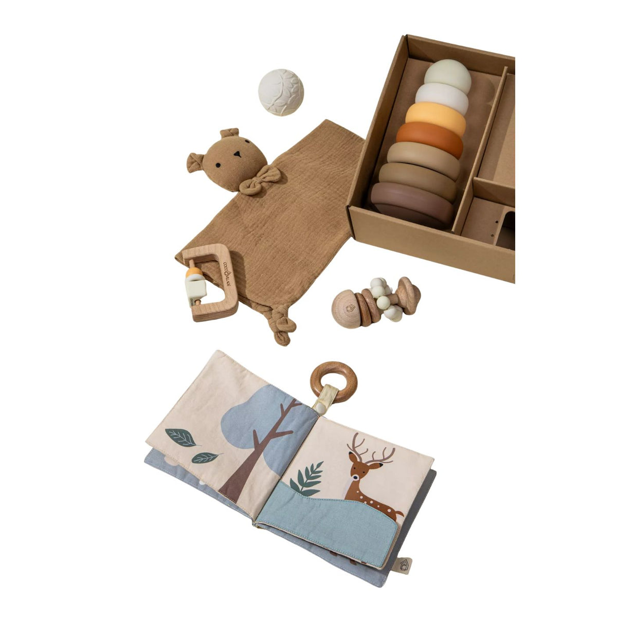 Collection of baby toys including a soft book, rattle, and ring stack on a white background