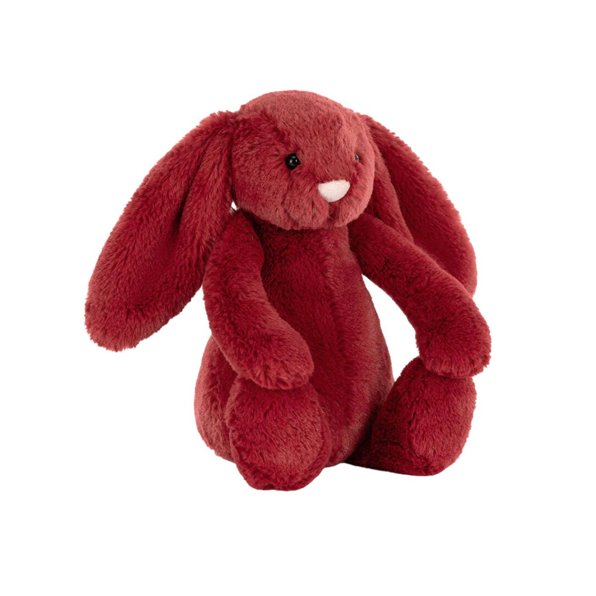 A plush red bunny toy with long floppy ears, black bead eyes, and a small white stitched nose, photographed on a plain white background.