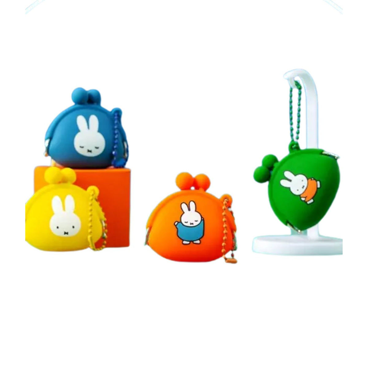 Set of colorful pouches with cartoon character on a white background
