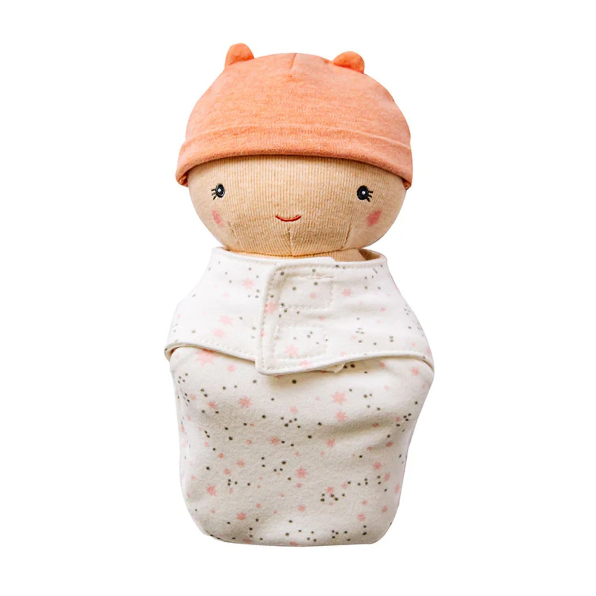 A plush baby doll swaddled in a patterned cream cloth and wearing a peach-colored knit hat with two small ear bumps, shown on a plain white background.