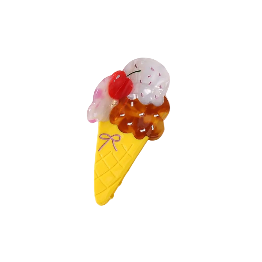 Toy ice cream cone with cherry on top on a white background