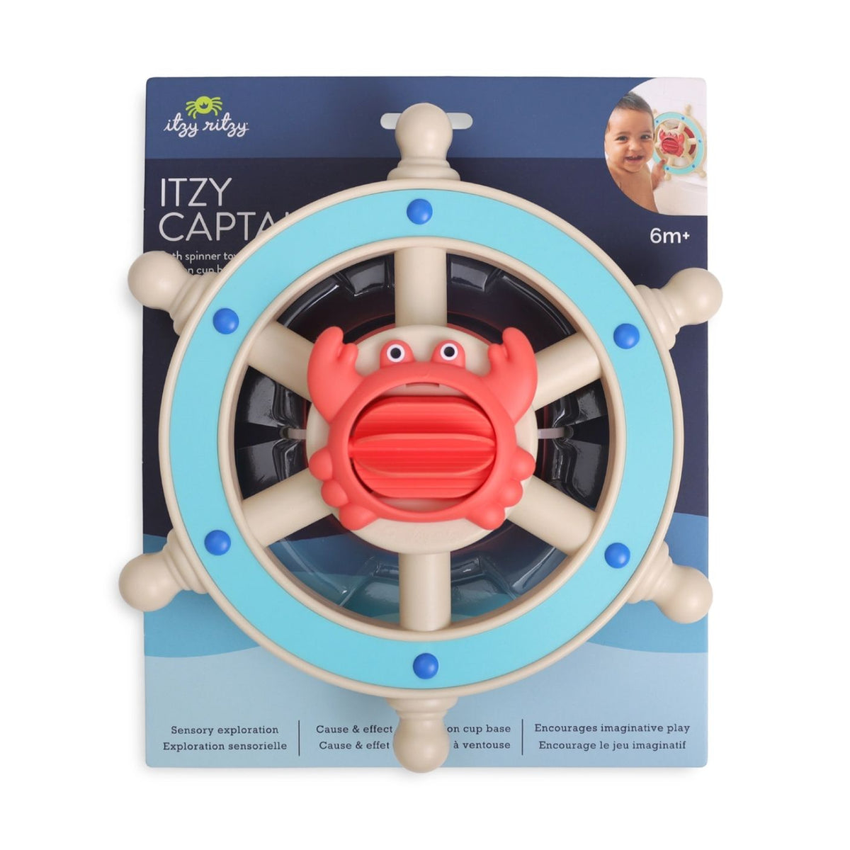 A baby toy ship's wheel with a crab in the center, mounted on a branded retail backing card. The product has a light blue outer ring, beige wheel spokes, and a coral-red crab with blue accents.