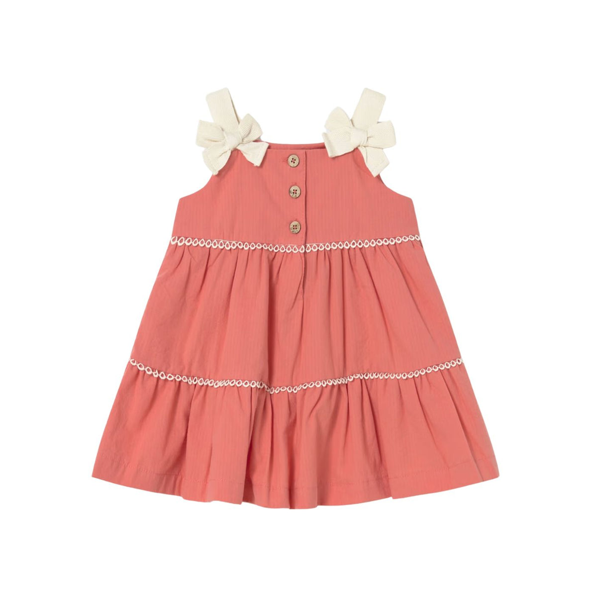 Coral dress with white bows on a white background