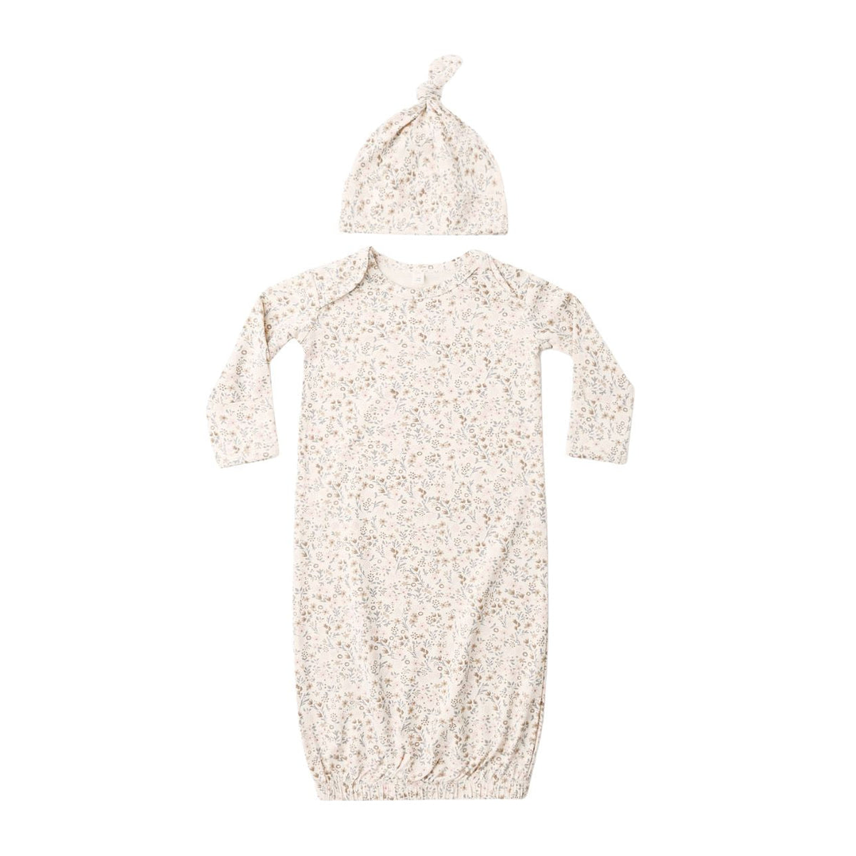 A baby sleep gown and matching knotted beanie hat set in a warm off-white fabric with a dense, small-scale floral print.