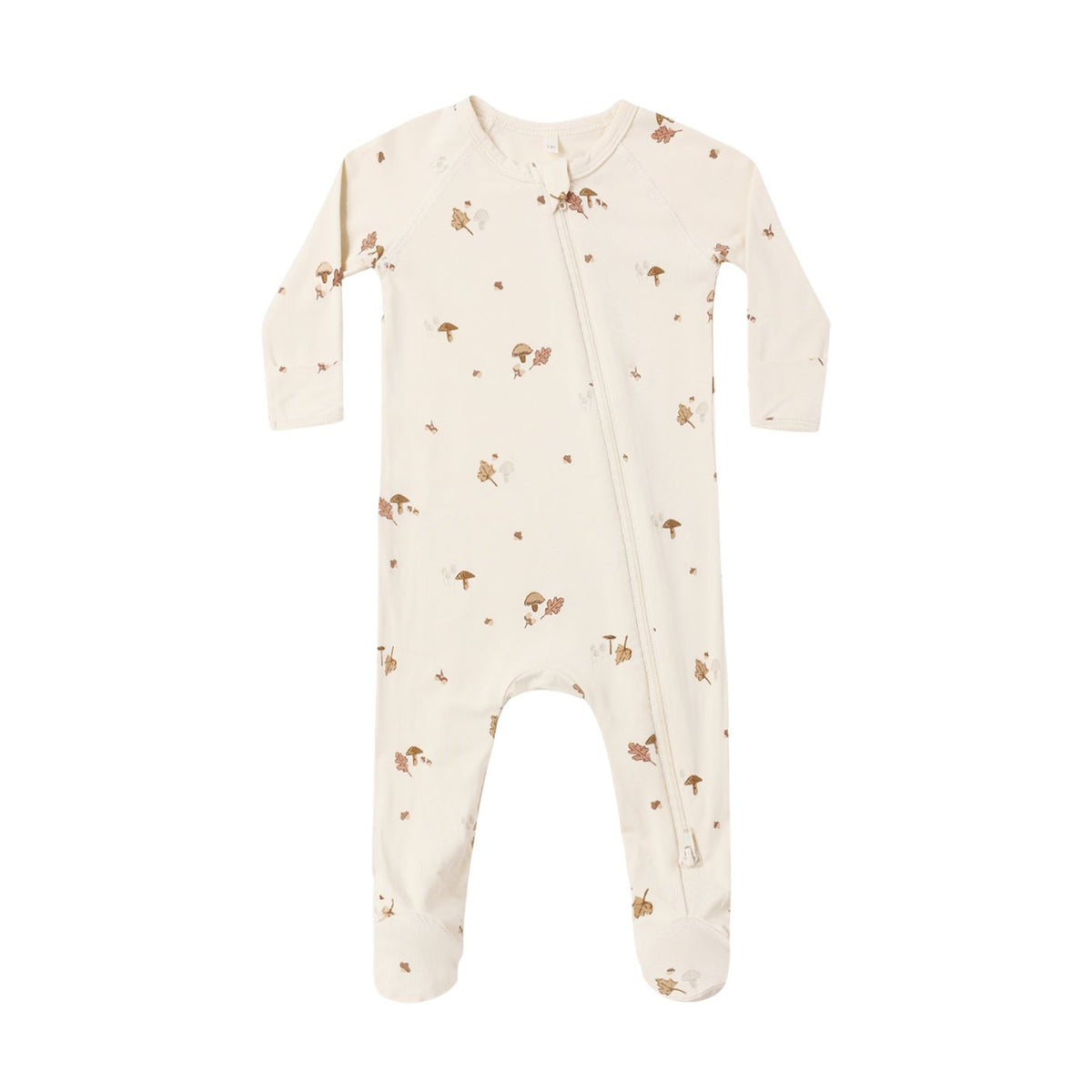 A baby footed sleeper in cream with a brown mushroom and leaf pattern, featuring a front zipper closure.