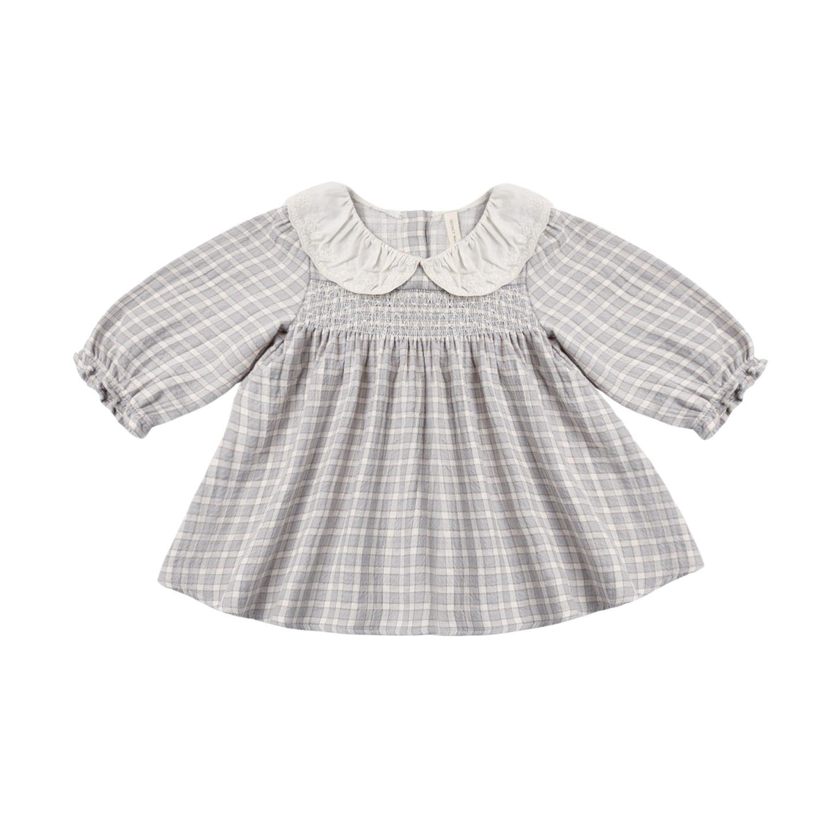 A toddler girl's long-sleeve smocked dress with a gray and white plaid pattern, featuring a white ruffled Peter Pan collar and gathered sleeves, shown against a plain white background.
