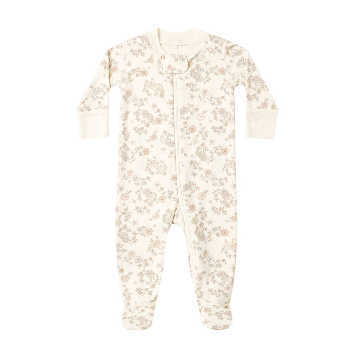 A baby long-sleeve footed sleeper in cream with a delicate beige floral pattern, featuring a snap closure at the neck.