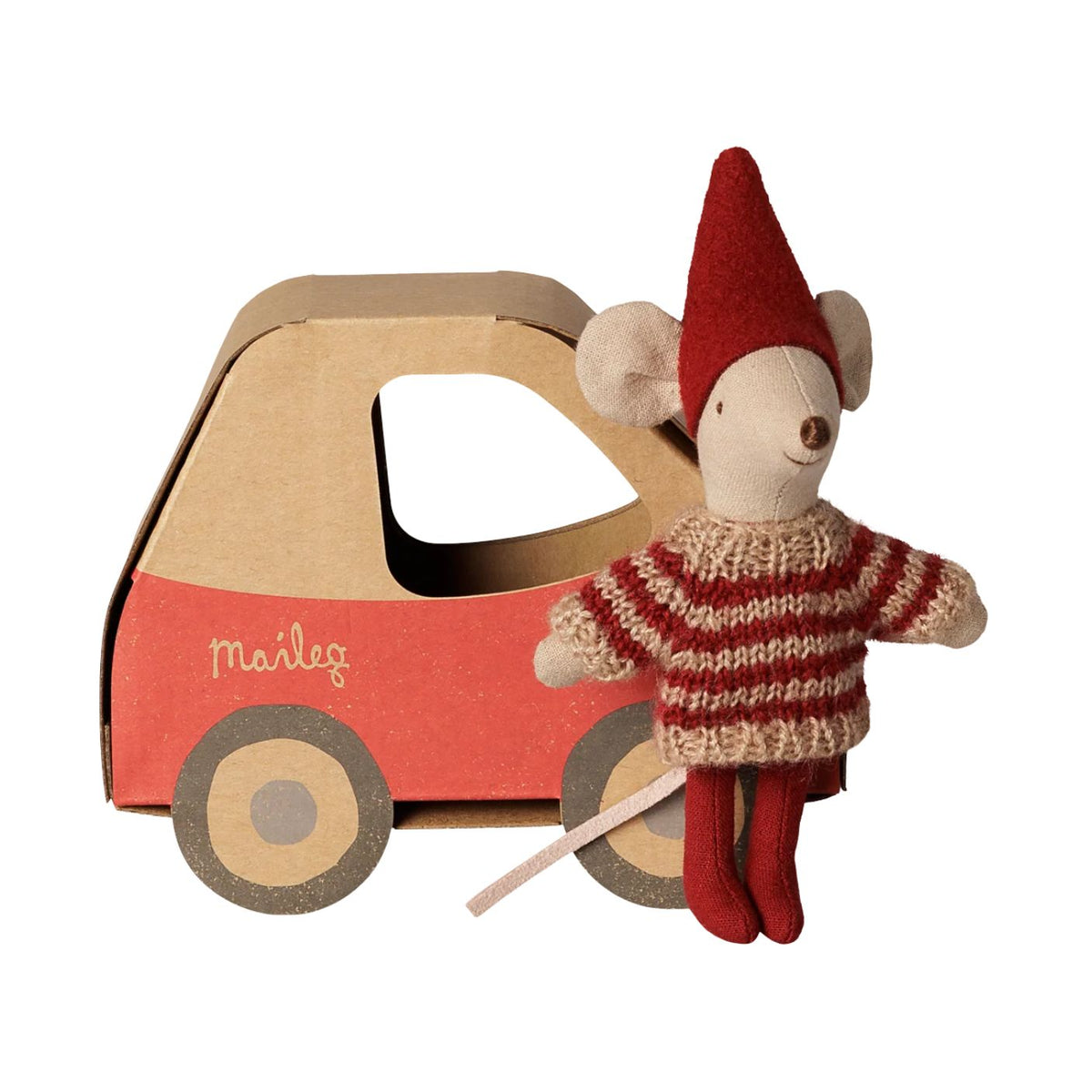 A Maileg Christmas Little Sister mouse wearing a red and white patterned knit sweater and a red pixy hat, standing next to a miniature cardboard car-shaped box labeled "maileg" with red detailing and wooden-look wheels.