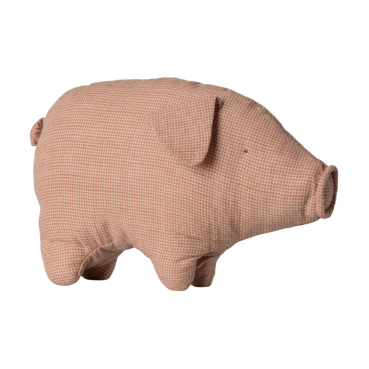A soft, dusty pink linen stuffed pig toy with a simple stitched face and a small curled tail, viewed from the side against a white background.