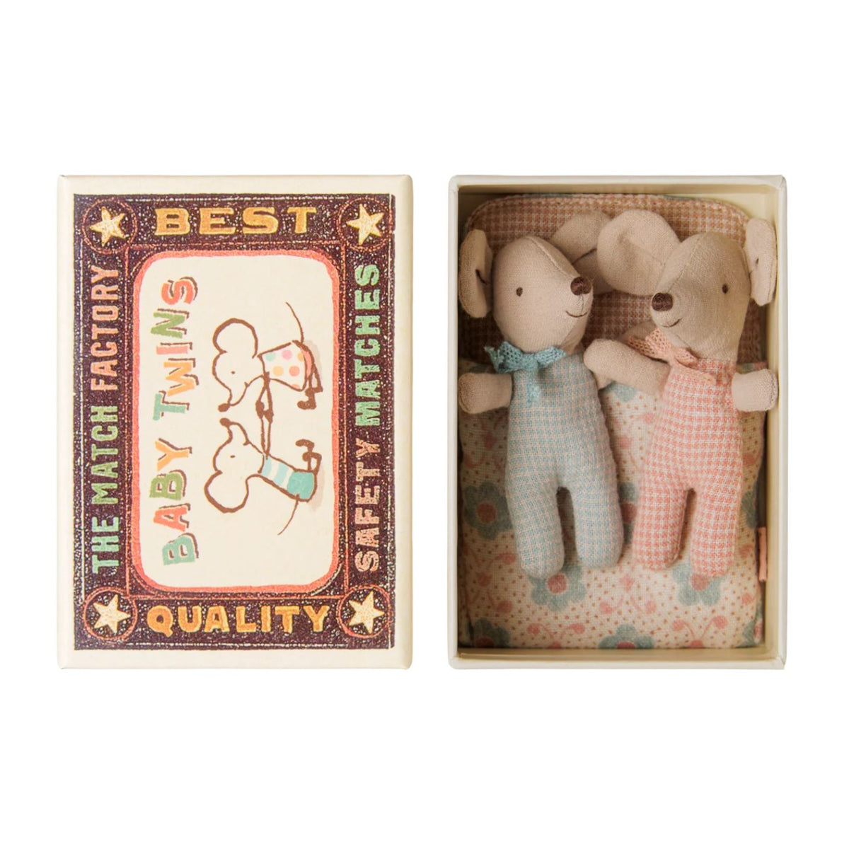 Two Maileg baby mice lying side-by-side inside an open matchbox bed, wearing patterned onesies and matching neck bows, next to the decorative matchbox lid labeled "Best Quality Baby Twins."