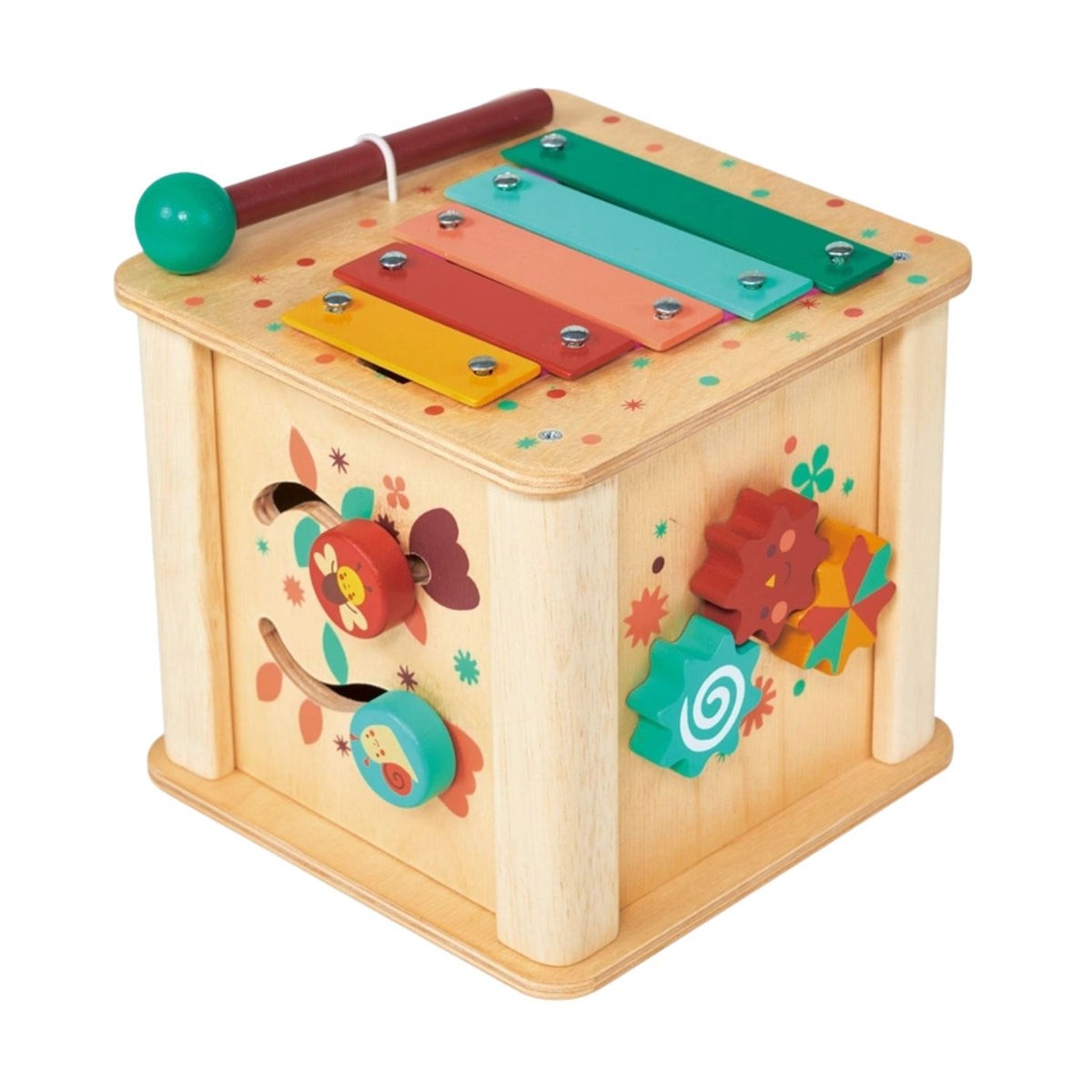 A wooden activity cube by Mentari on a plain white background, featuring a colorful xylophone with a matching red mallet resting across the top, interlocking green and orange gears on the side, and playful spinning panels.