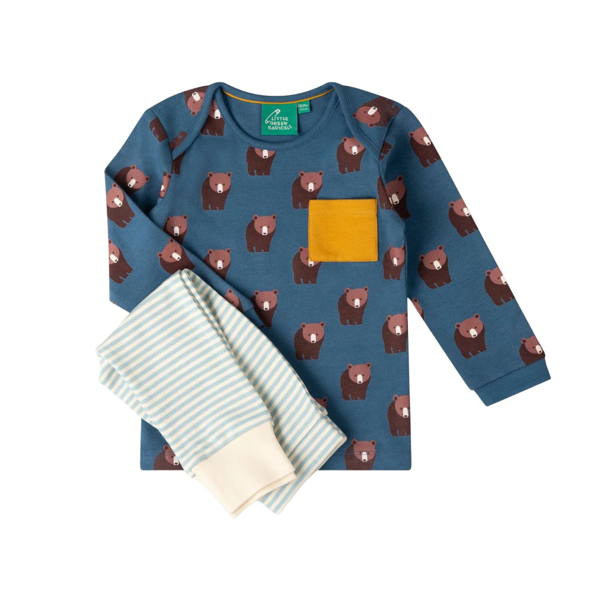 A children's two-piece pajama set from Pajama Paradise, featuring a long-sleeve top in slate blue with a brown bear print and a mustard yellow chest pocket, paired with light blue and white striped pants with cream cuffs, laid flat on a pale pink background.