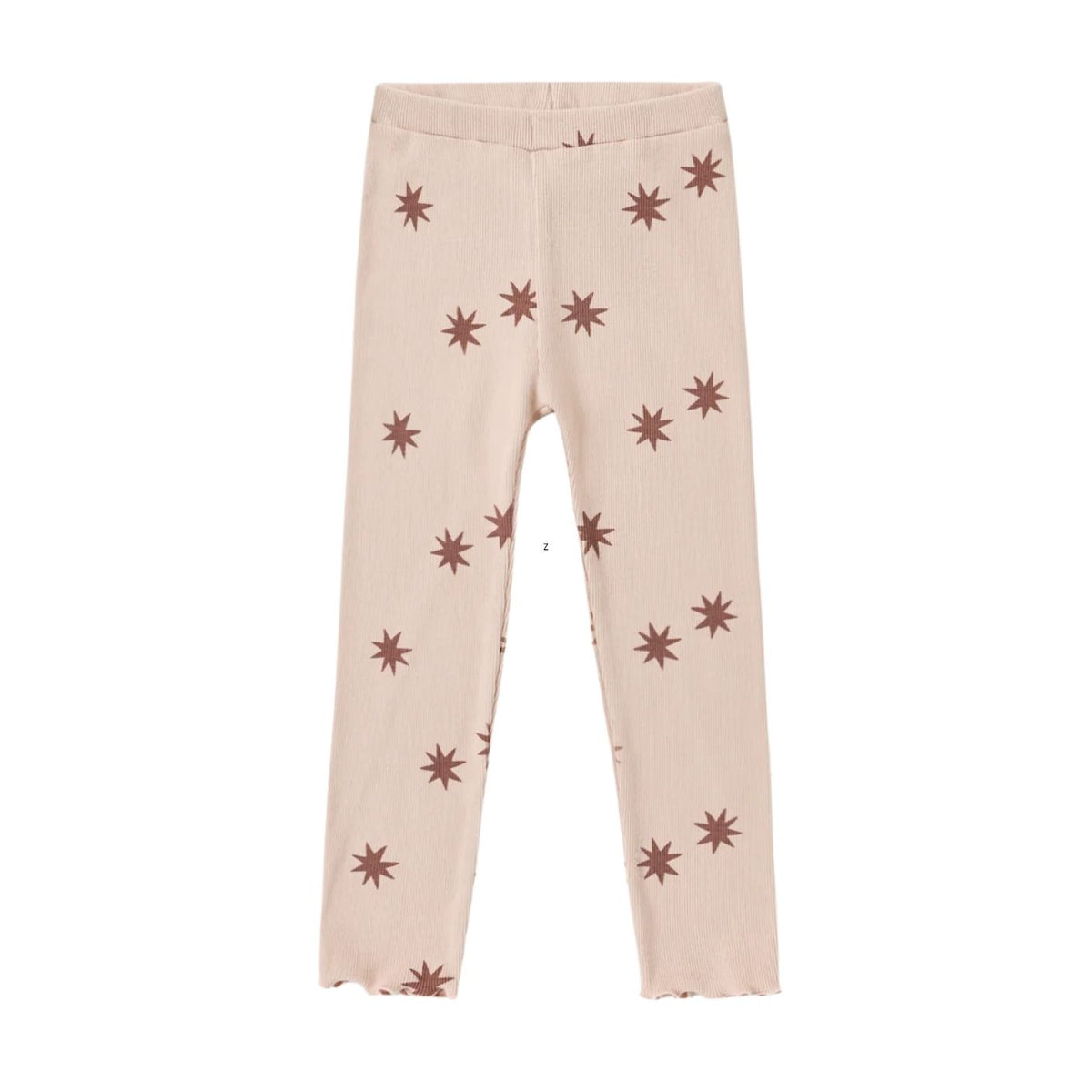A pair of light beige ribbed leggings with an all-over brown starburst pattern, shown flat against a solid white background.