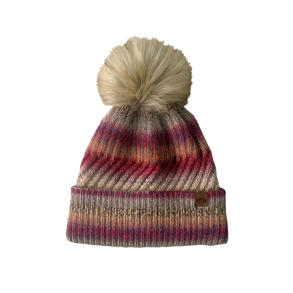 Knitted beanie with a pom-pom on a white background
