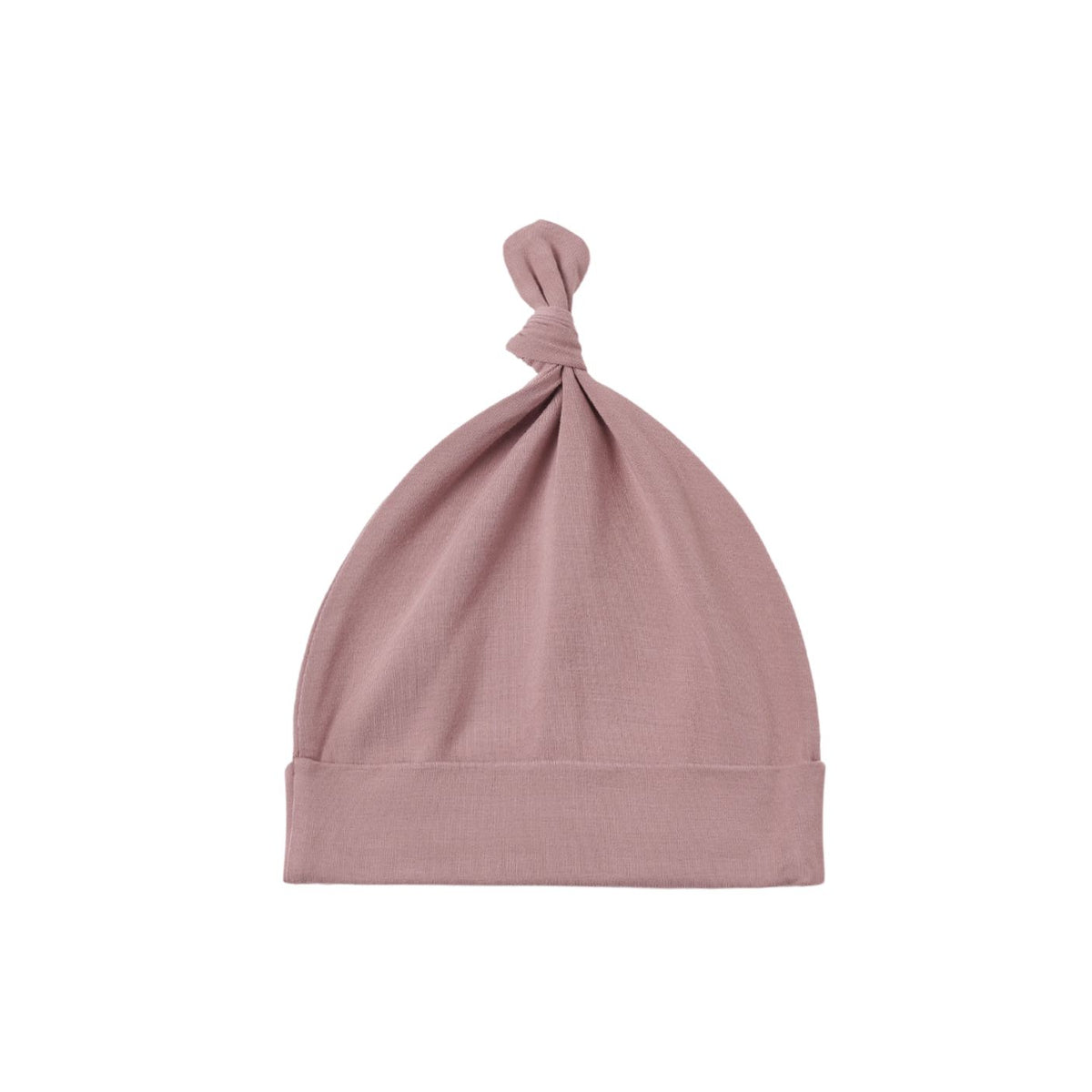 A dusty pink knit baby beanie hat with a knotted top and folded cuff, shown on a plain white background.
